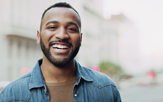 Portrait of a handsome young man in the city